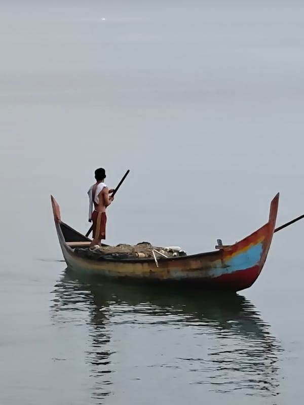 Calm evening on the Lhokseumawe coast: fishing, boats, and stray cats