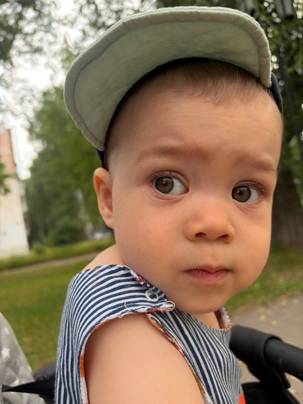 Close-up portrait in pale blue cap, Chaikovsky, Russia.