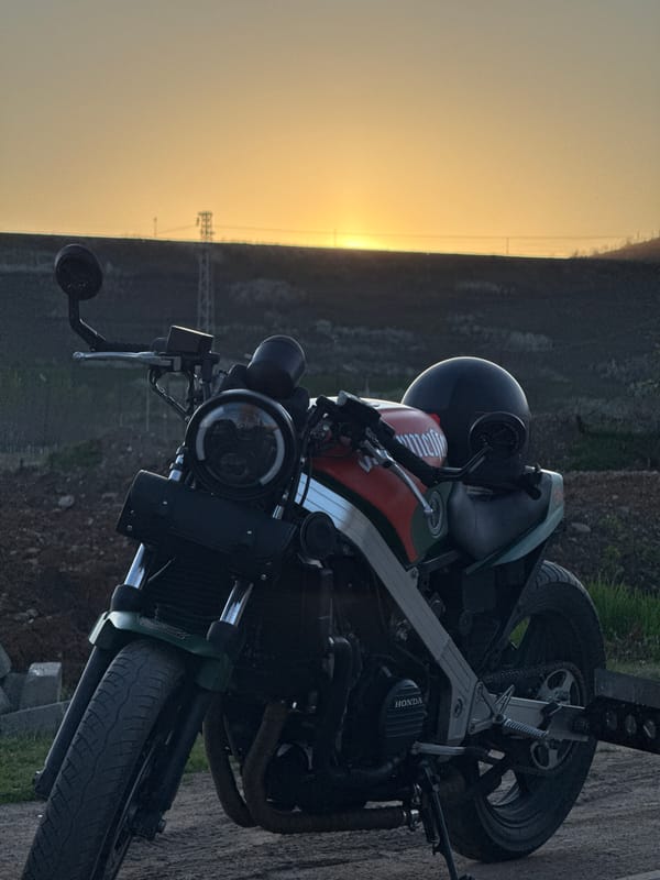 Motorcyclist takes sunset break in rural Montana, Bulgaria
