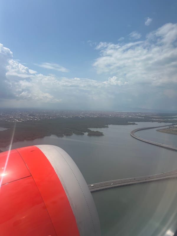 Aerial view captured of Kuta coastline from airplane window