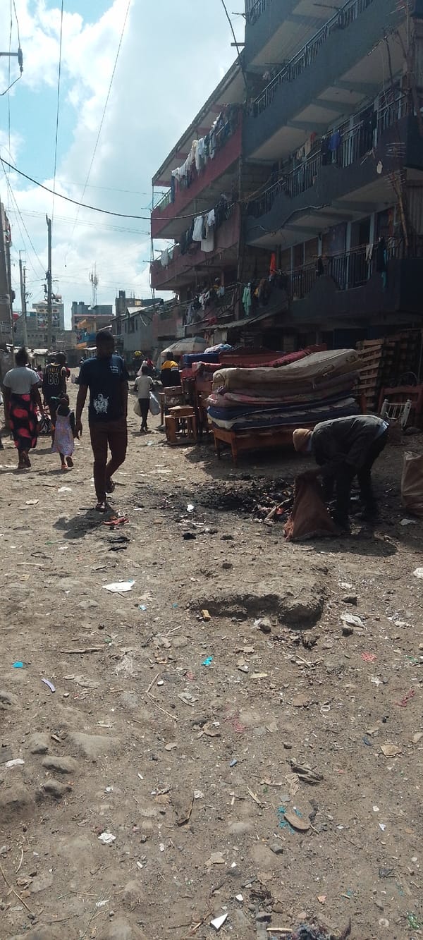 Man searches debris on littered Nairobi street