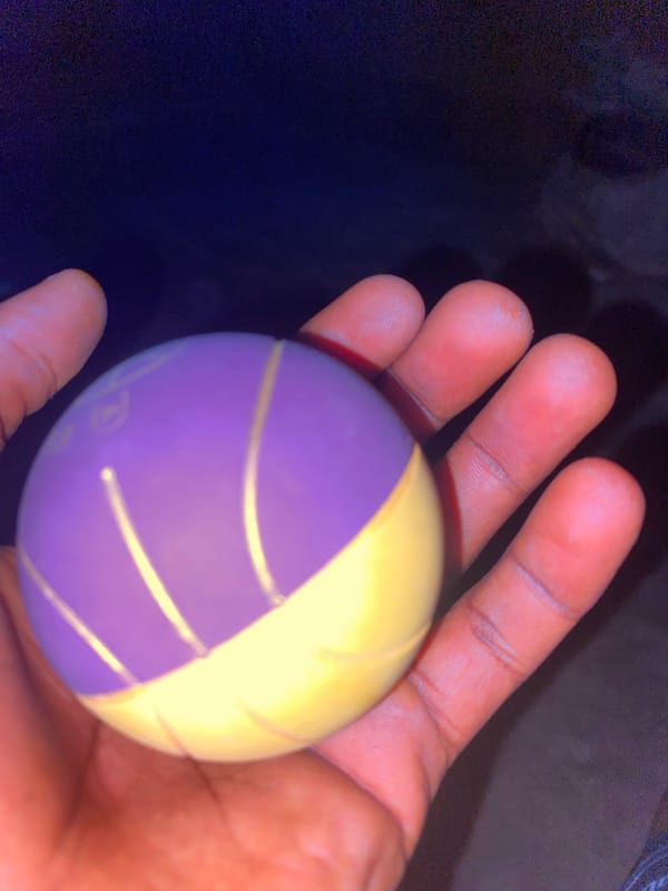 Close-up looks at a small ball on a Nigerian night road