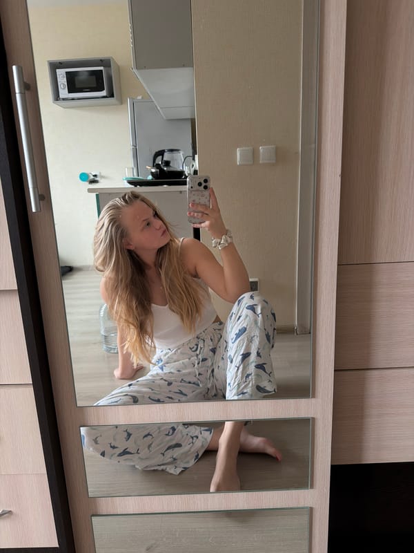 Woman takes late-night mirror selfies in whale pajamas