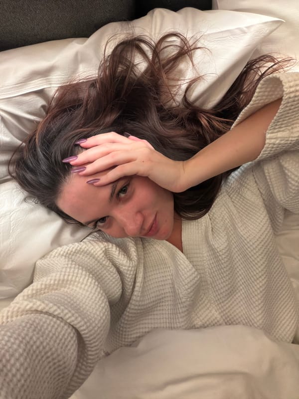 Woman photographed on bed in Athens residence
