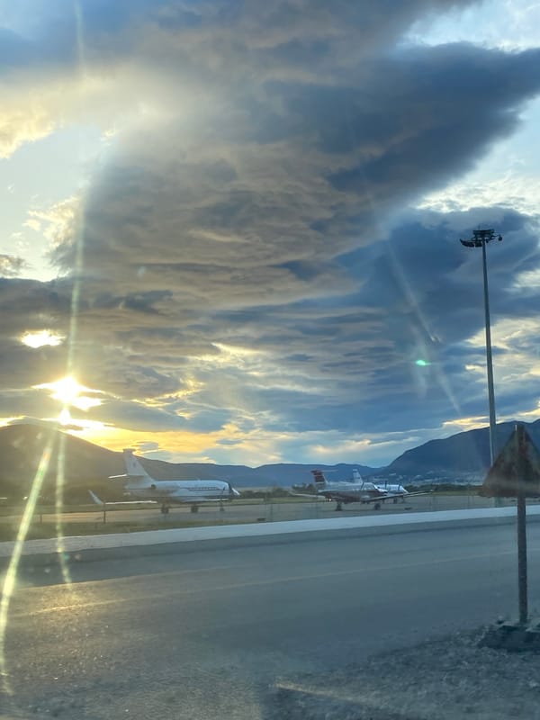Aircraft parked at Montenegro airport amid dramatic mountain scenery
