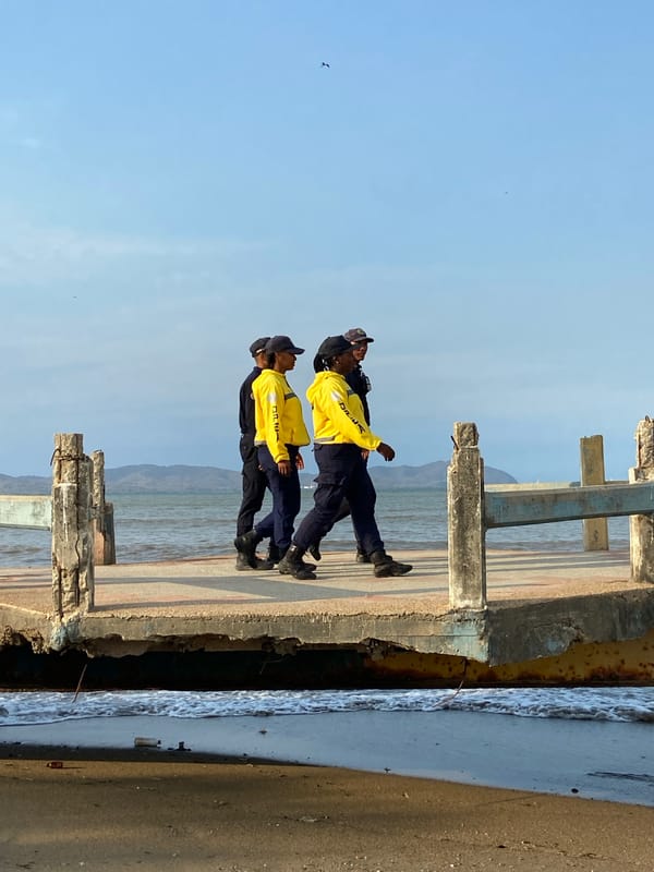 Weathered fishing boats docked at Higuerote waterfront, Venezuela