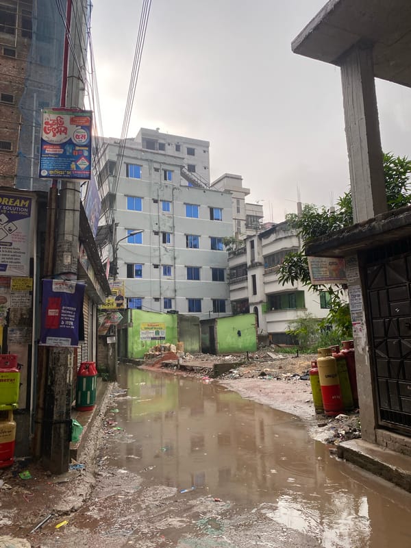 Morning rainfall floods Dhaka streets, affects construction sites