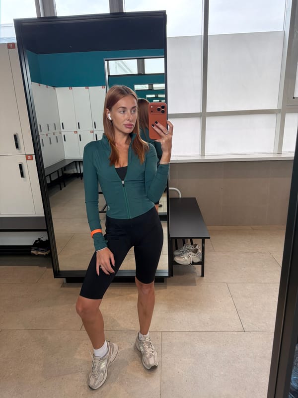 Woman documents workout session with locker room selfies