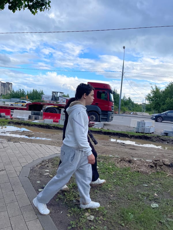 Afternoon at a Moscow lakeside park, city skyline in view