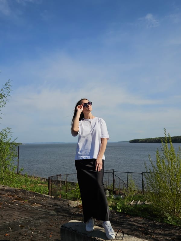 Woman poses for photos near water in Chaikovsky, Russia