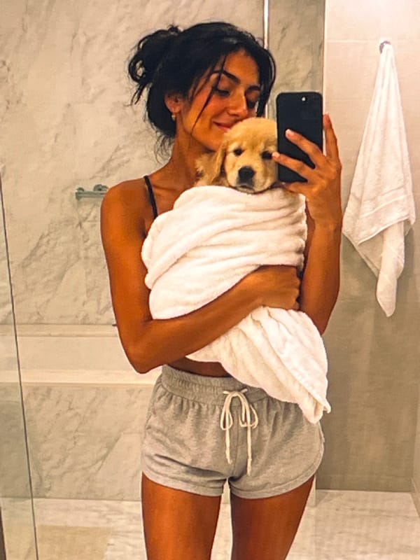 Puppy bath time and cuddles in Athens bathroom