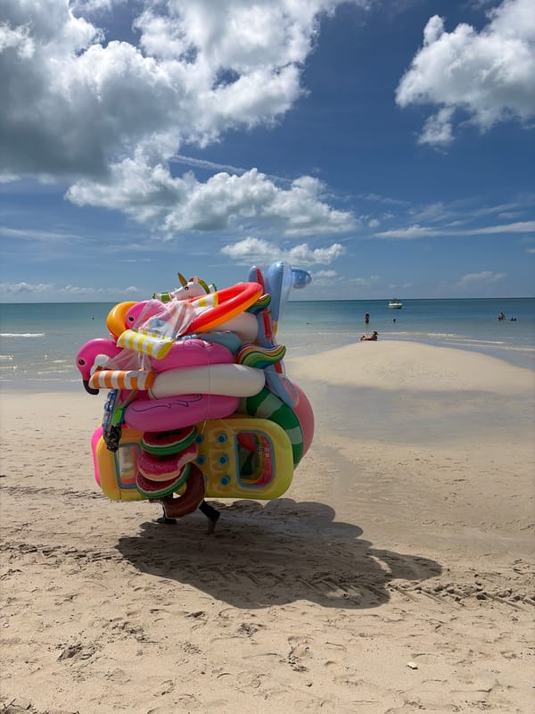 Colorful inflatables and beach vibes on a calm summer day