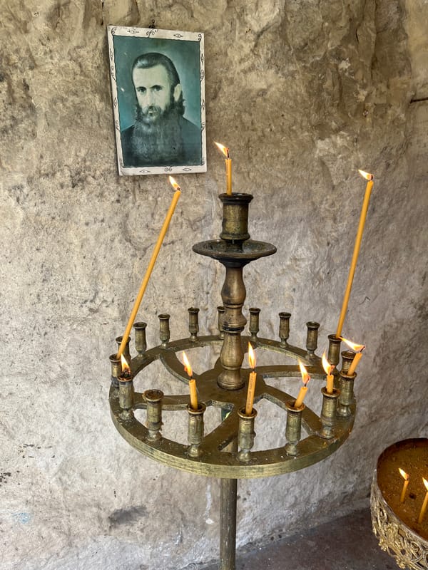 Visitor documents historic Basarbovo Rock Monastery in Bulgaria