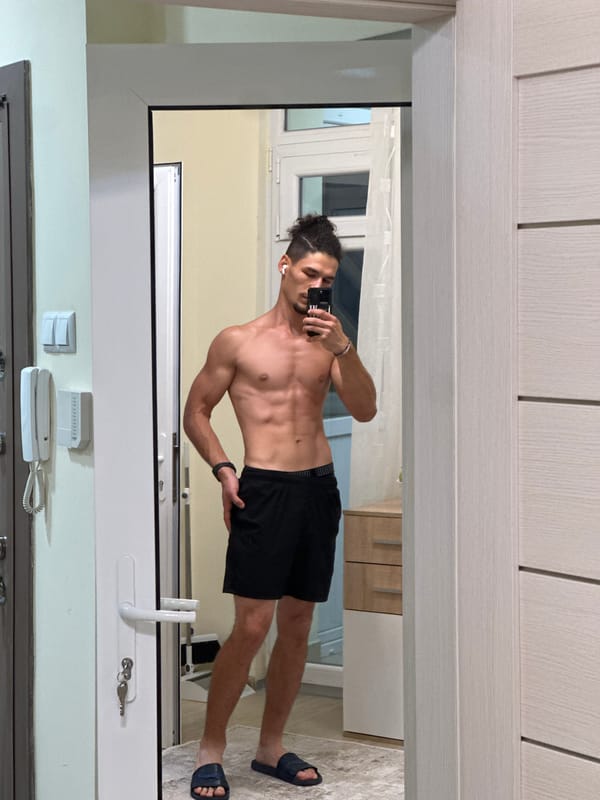 Mirror selfie session in a Varna apartment hallway