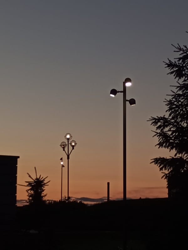 Evening scenes documented across two Russian cities during dusk