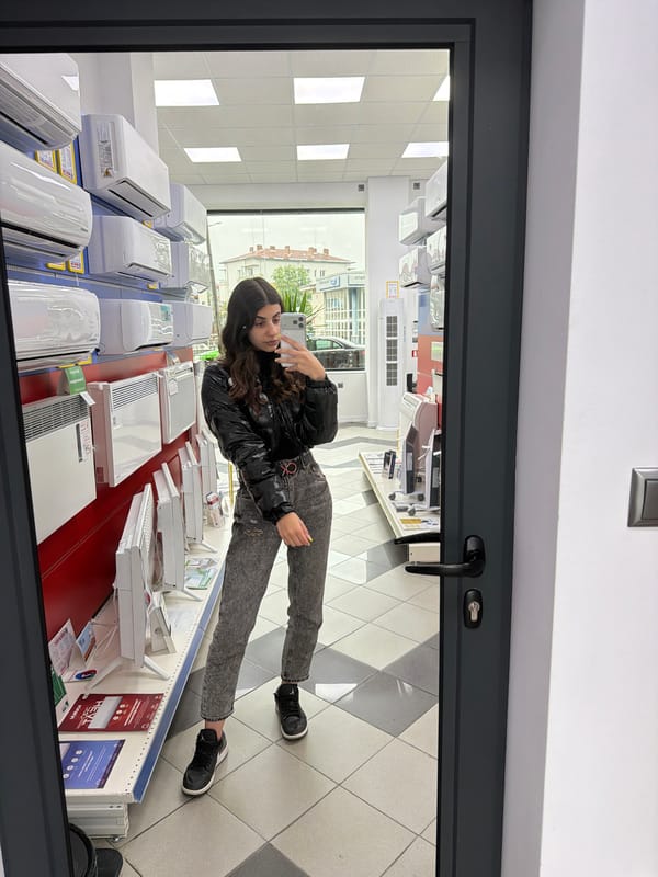 Woman takes selfie in HVAC store Friday morning
