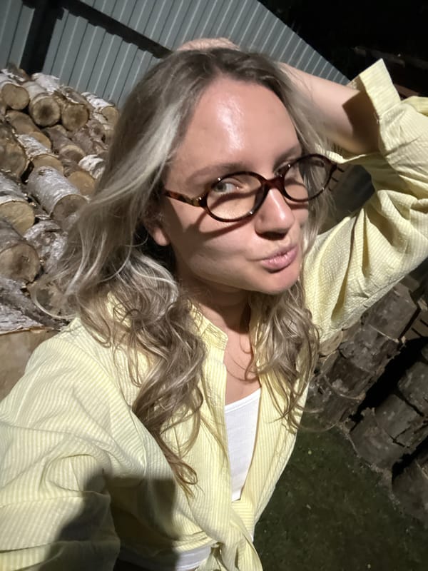 Nighttime selfie in Slantsy, tortoiseshell glasses and striped shirt