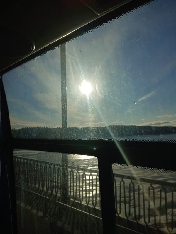 Driver captures sunny sky view through vehicle windows in Usolye