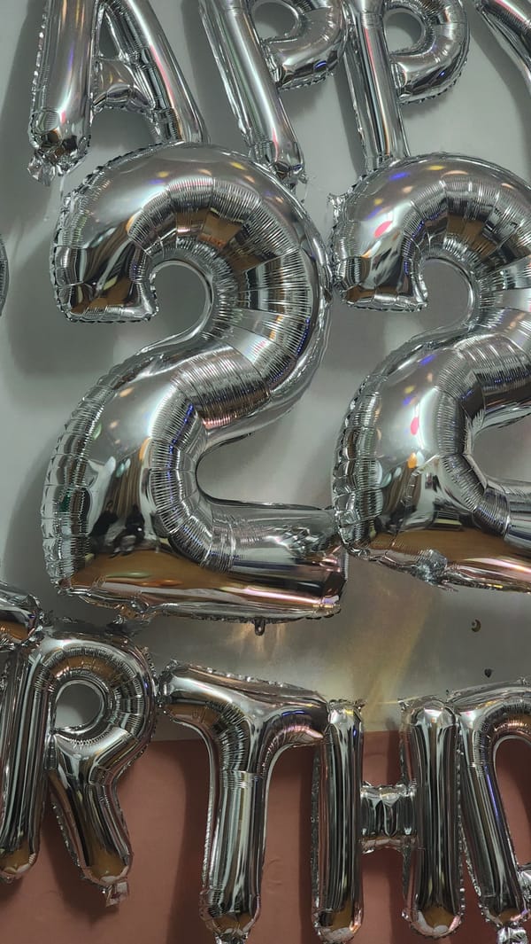 Silver "2024" balloons displayed on wall in Zhongtun
