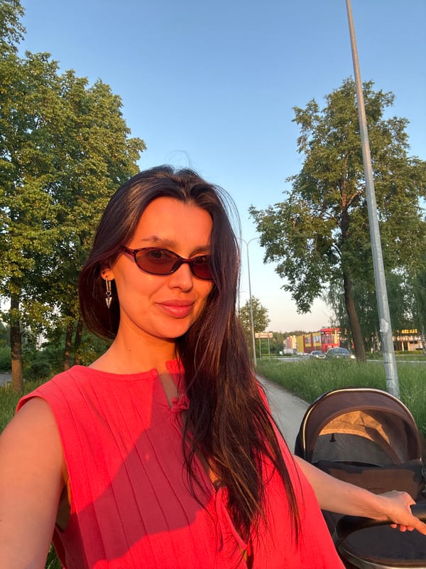 Woman takes selfies while strolling with baby in Chaikovsky