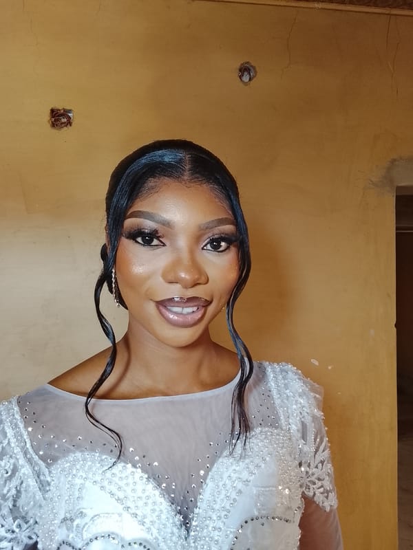 Young woman in white dress photographed indoors Saturday morning