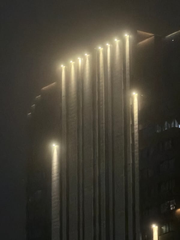 Fog and artificial light across Yekaterinburg after dark