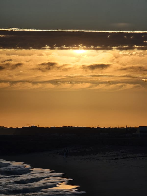 Warm sunset over Quarteira beach, Portugal