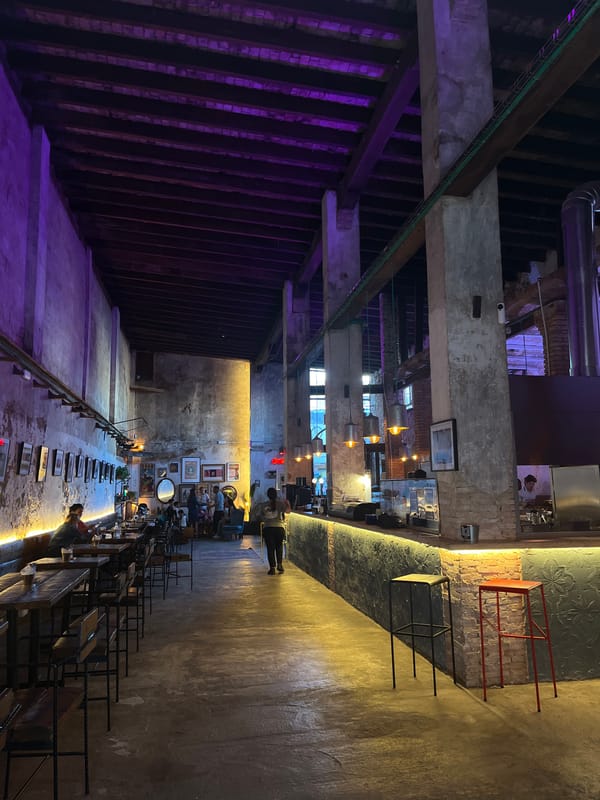 Bar interior with purple lighting documented in Torrent