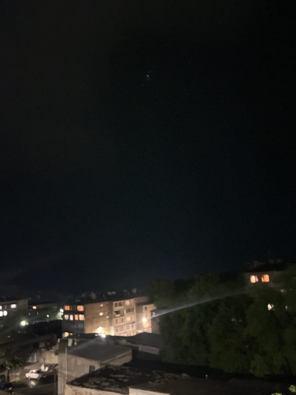Lightning storm over Gladzor's residential neighborhoods at night