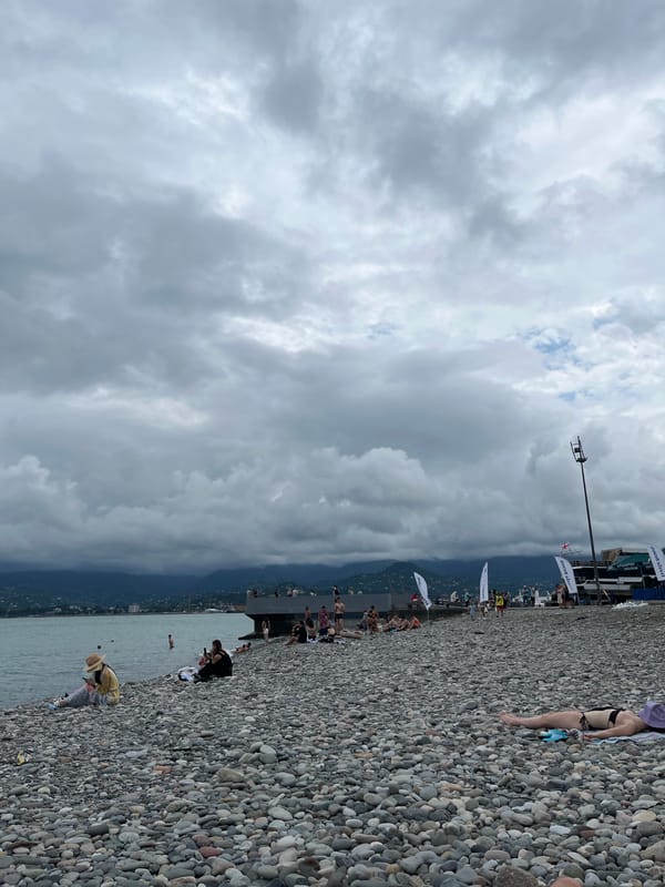 Overcast beach day on Batumi's Black Sea pebble shore