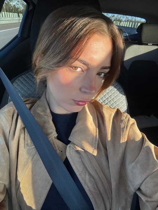 Woman takes car selfies in Figueira da Foz morning