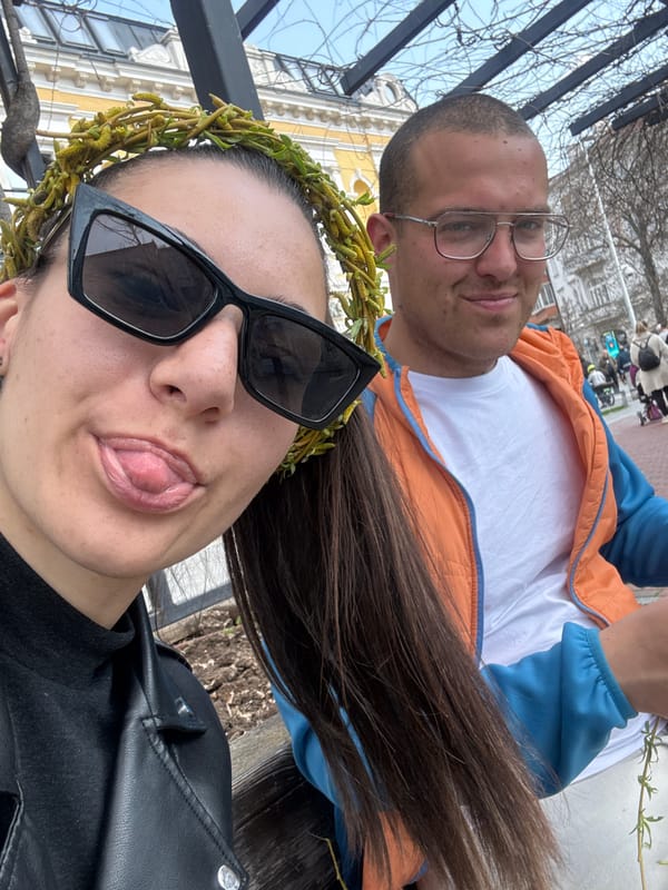 Tourists pose for selfie near bronze sculpture in Varna