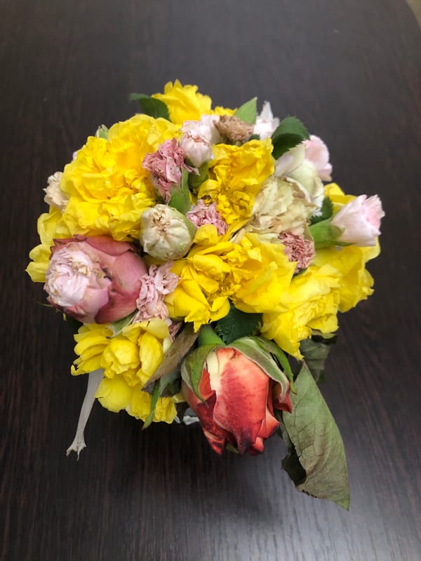 Evening hospitality gathering documented in Yerevan with flowers, food
