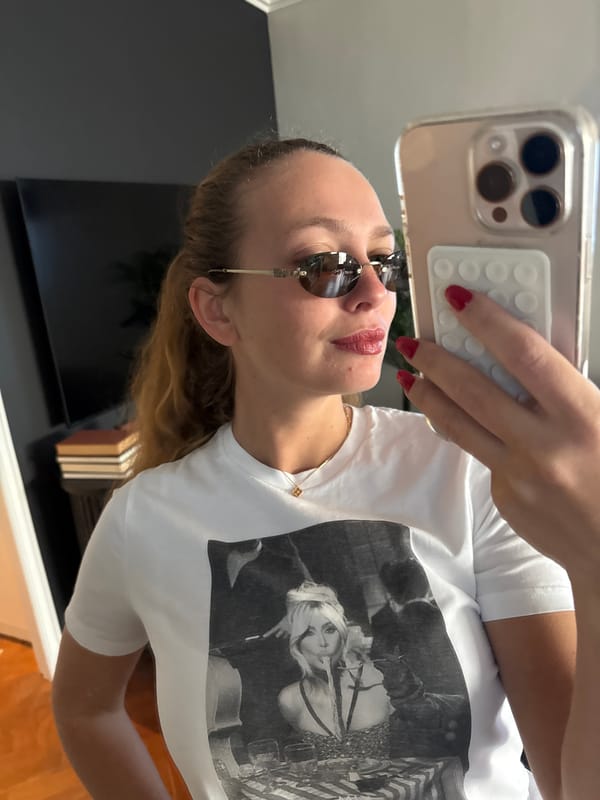Woman takes multiple selfies indoors in Cape Town