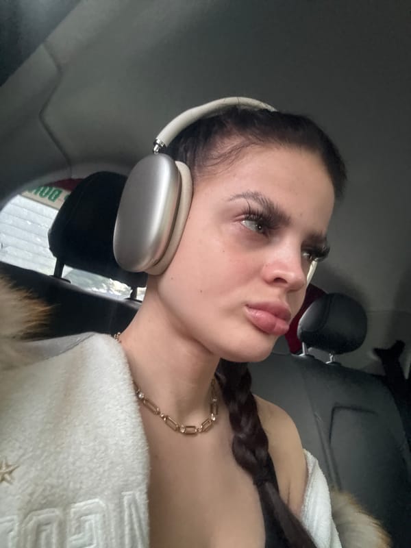 Two close interior car shots, headphones on, Hà Nội