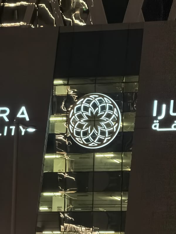 Modern building facade illuminated at night in Lusail, Qatar
