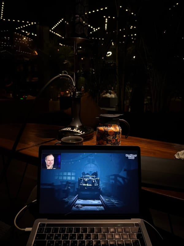 Gamer streams dark video game from dimly lit Kuta room