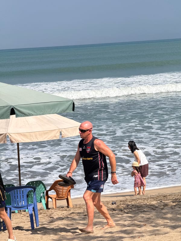 Kuta Beach in full swing — surf, sand, and shoreline life.