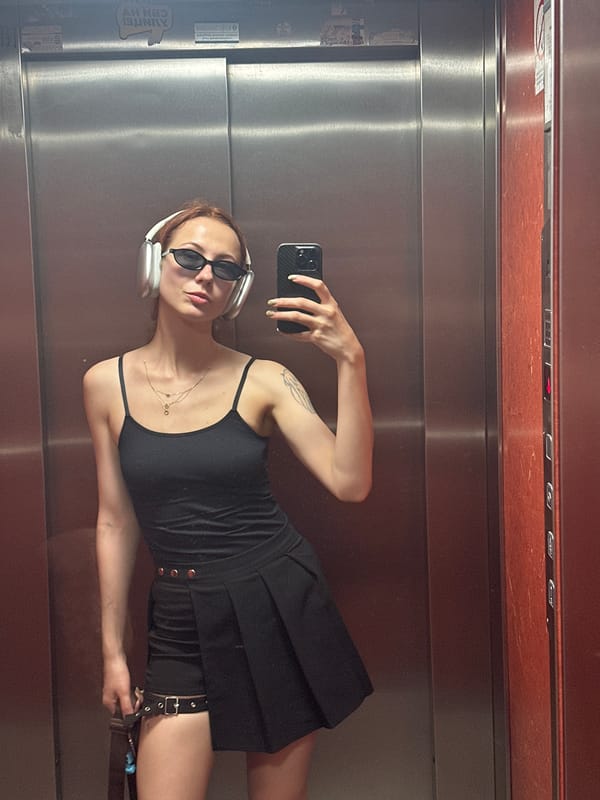 Woman Takes Multiple Elevator Selfies With Plant in Novi Sad