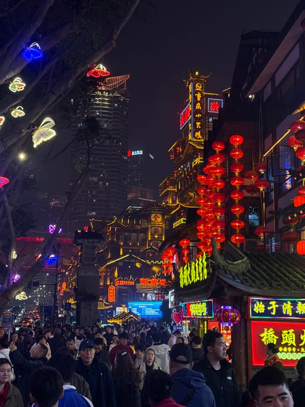 Nighttime crowds gather at Chongqing's illuminated Hongyadong tourist district