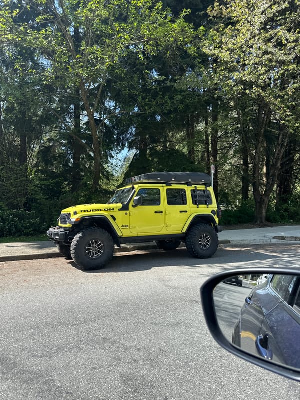 Yellow Jeep Rubicon parked on Coquitlam roadside