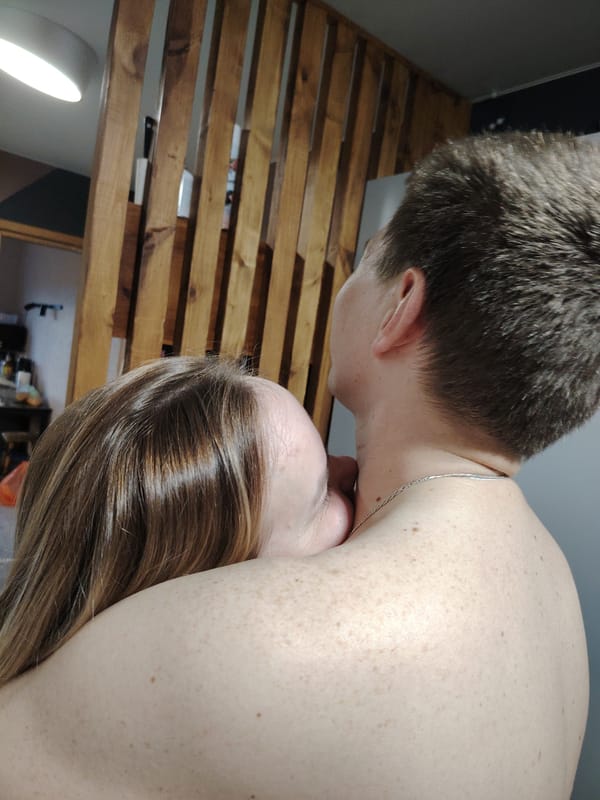 Intimate embrace captured between two individuals at unknown location