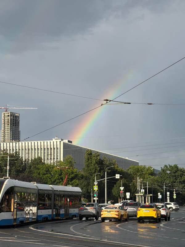 Rainbow over a wet Moscow intersection after summer rain