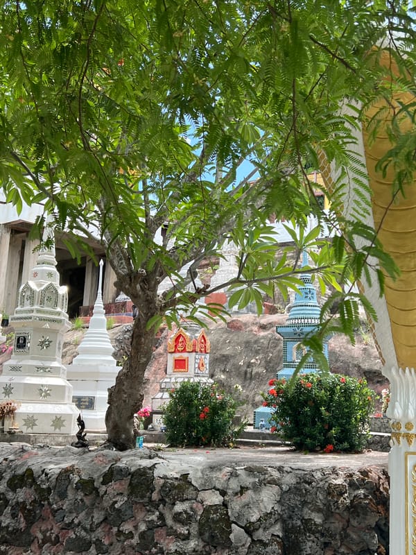 Ornate red temple complex and coastal views in Baan Hua Thanon