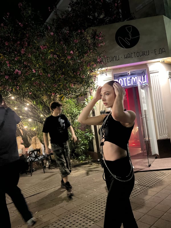 Night out at a Sochi bar, neon-lit street scene