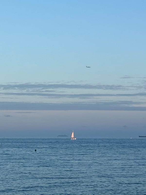 Evening beach activities documented along Barcelona's Barceloneta coastline