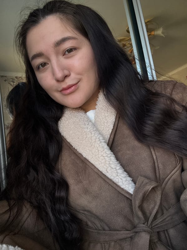 Woman takes selfies indoors in Kurovskoye, Russia