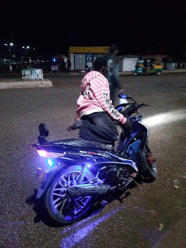 Nighttime street market activity in Bukuru, Nigeria