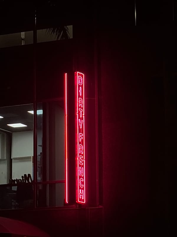 Nighttime Miami scenes show restaurant signage and street traffic
