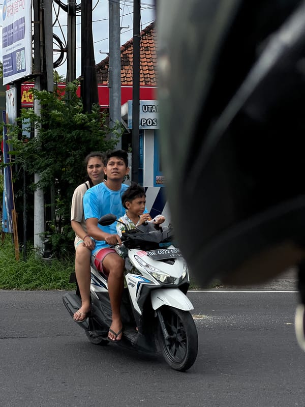 Three riders spotted on white Honda motorcycle in Denpasar